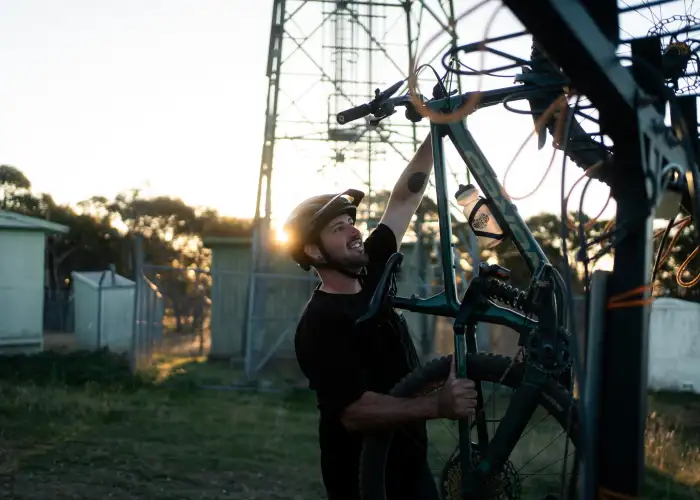 Rider unloading Bike from car rack